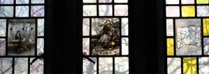 After library employees in the early 1990s complained about a stained glass pane originally titled “Negro with a watermelon,” the pane was removed and replaced with the pane on the far right.
